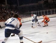 Gordie Howe passes to Frank Hughes, February 24, 1974.