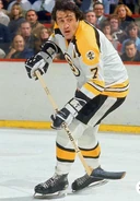 Phil Esposito displaying the Bruins 50th anniversary patch.