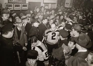 Frank Brimsek and Eddie Shore (his broken nose from the Semis still bandaged) lead the team onto the ice during the 1939 Stanley Cup Finals. Following them are #4 Harry Frost, #5 Dit Clapper, #7 Cooney Weiland and #8 Jack Portland.
