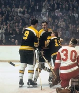 #9 John Bucyk, Phil Esposito and John McKenzie celebrate a goal in the new black jerseys, February 4, 1968.