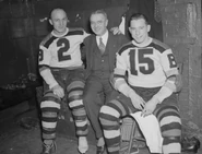 Eddie Shore, after his last game with the Bruins, with Dr. Crotty and Milt Schmidt, December 5, 1939.