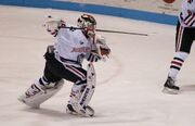 A goalie heads to the bench in order to allow for an 