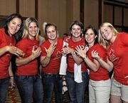 June 2010: (Left to right) Caroline Ouellette, , , Gina Kingsbury,  and  proudly display their Olympic rings.