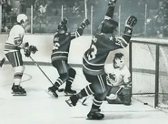 Larry Lund scores on Gilles Gratton as Wayne Dillon and Andre Hinse look on, December 2, 1974.