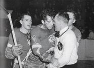 7Nov1942-Orlando bloody.jpg (260 KB) A bloodied Jimmy Orlando after a stick swinging fight with Leafs Gaye Stewart leans against King Clancy, November 7, 1942.