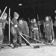 Young boys are taught proper body checking technique.
