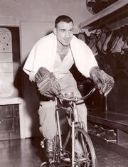 Toppazzini rides an exercise bike in Detroit while recovering from facial surgery, March 1957.