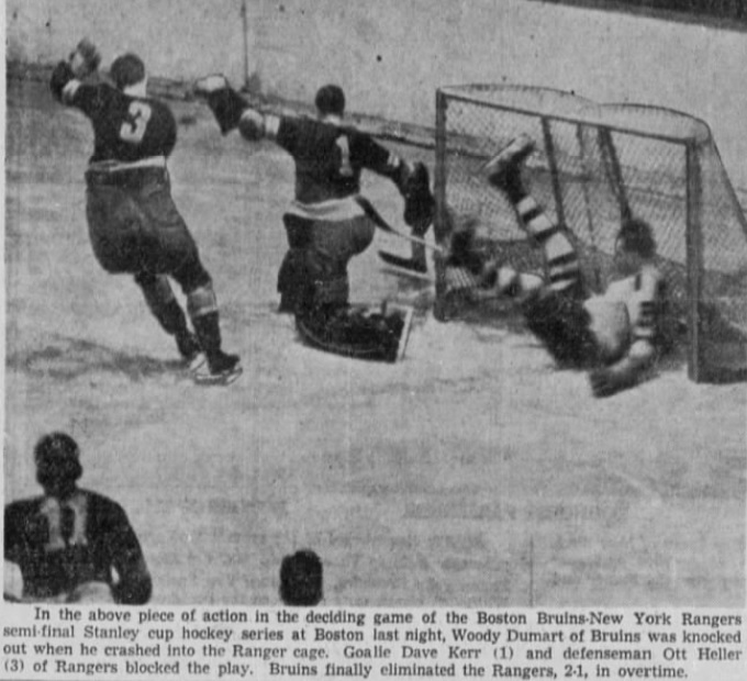 Bruins goalie, Tiny Thompson, stops shot in action around the net