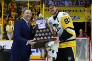 NHL Commissioner Gary Bettman presenting Conn Smythe Trophy to Sidney Crosby