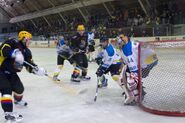 A hockey game being played in this stadium.