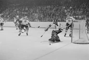 Don Awrey, Bernie Parent, Bob Woytowich in 1965-66 season action.