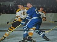 Bob McCord, Leafs Don McKenney and Ron Schock in 1964-65 action.