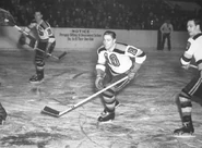 #10 Fern Flaman and #15 Milt Schmidt during a 1947-48 game.