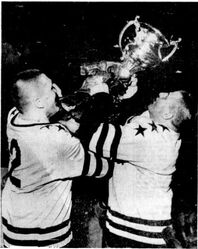 Miners celebrate with the Allan Cup