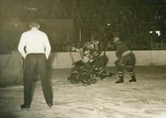 Don Gallinger and Joe Carveth attack Chuck Rayner, December 29, 1946.