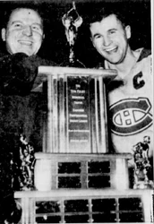 League president Ed Huston presents the Tom Foley Memorial Trophy to Hull-Ottawa captain Al MacNeil.
