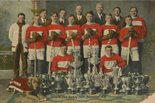 Cross, third standing redshirted player from left, with the  in 1912–13.
