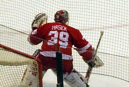 Detroit Red Wing goalie Dominik Hasek, of the Czech Republic (39), is  unable to stop a goal from Chicago Blackhawks' Patrick Sharp (10) during  the third period of an NHL hockey game