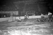 Connie Brown dekes Earl Robertson during Game 2 of the 1940 Quarter-finals, March 22, 1940.