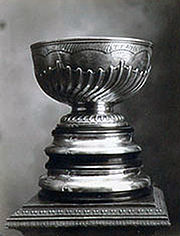 Silver trophy with bowl on top