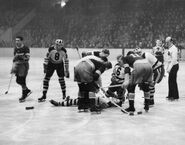 Charlie Sands hurt in a regular season game against the Rangers. #6 Pettinger and #8 Portland look on.