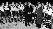 President Calder presenting the 1939 Stanley Cup to the Bruins.