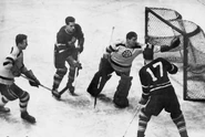 Brimsek stops Leafs #17 Cal Gardner in 1949 Semi-finals action.