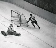 Milt Schmidt scores the second last goal of his career on Gump Worsley, November 17, 1954.