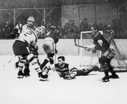 Bruins Eddie Shore (#2), Bert McInenly, goalie Tiny Thompson hold off the Rangers, December 30, 1934.