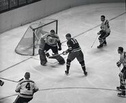 Bruce Gamble stops Rangers Vic Hadfield during the Bruins 20 game winless streak, January 31, 1962.