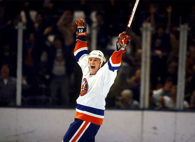 Playoff MVP Mike Bossy holds up the Islanders' third straight