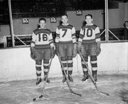 Phil Bessler, Alex Motter, Gerry Shannon in Boston Cubs uniforms, 1935-36 season.