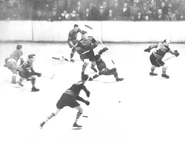 Wings Herbie Lewis falls while Hawks #2 Clarence Abel defends, Game 1 of the 1934 Stanley Cup Finals on April 3, 1934.