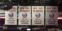 Banners representing the Islanders' four  victories.