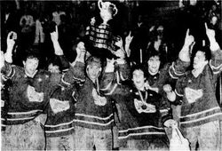 Royals' captain Dan Daoust raises the cup with his teamates.