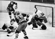 Stags John Miszuk and goalie Paul Hoganson, Jets Ulf Nilsson and Anders Hedberg during the last victory in Stags history, January 9, 1975.