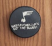 Promotional puck deriving from 's efforts to relocate the  to Saskatoon in 1983