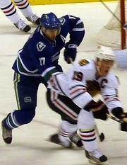 Kesler checking  captain  during a 