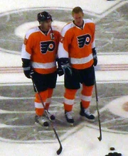 Richards (left) and  prior to a Flyers game