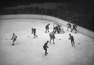 Bruins #5 Dit Clapper, #7 Cooney Weiland battle Leafs #4 Hap Day and goalie Lorne Chabot on March 10, 1931.