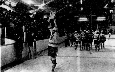 Petrolia captain Barry Edgar with the cup after Petrolia's win.