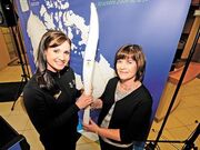 Mikkelson posing with the Vancouver Winter Games Torch