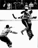 J.C. Tremblay hugs Gump Worsley at the end of the seventh game.