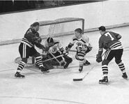 Doug Mohns, Bernie Parent, Bobby Orr and #7 Phil Esposito in 1966-67 season action.