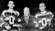 Sydney Holmstead, head of the QHL, with trophy winners Howard Riopelle (left) and Dusty Blair.