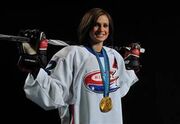 Mikkelson sporting an Edmonton Chimos along with her 2010 Winter Games gold medal