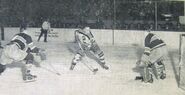 Flash Hollett doesn't score on his attempt on Bert Gardiner in this November 30, 1941 game won 3-2 by the Bruins. Habs #8 Tony Graboski defends.