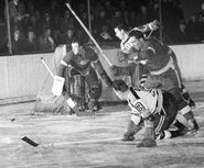 Mel Hill takes a shot on Johnny Mowers in Game 1 of the 1941 Stanley Cup Finals.