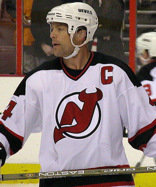 Scott Stevens of the New Jersey Devils takes the Stanley Cup from