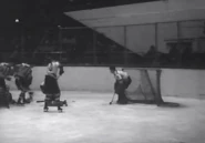 Bill Cowley clears the puck away from Frank Brimsek, November 4, 1939.